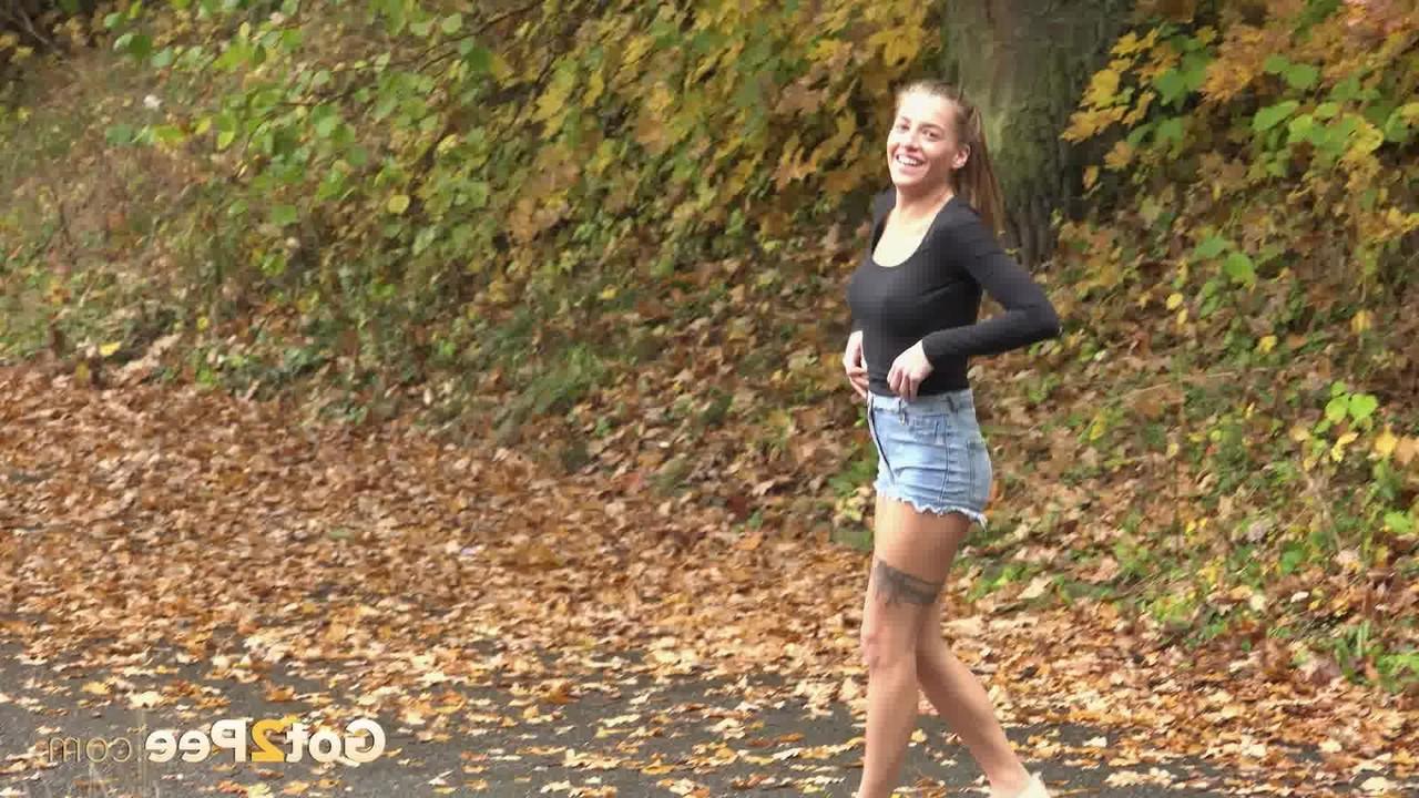 15P Skinny young Silvia Dellai can't hold it & drops hers shorts to pee outdoors