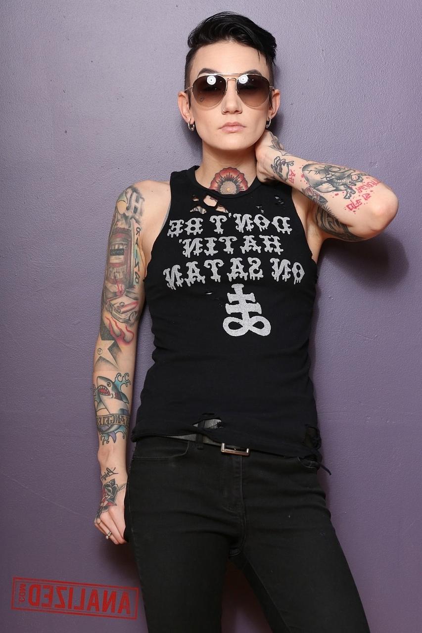 17P Androgynous model Nikki Hearts shows her tattoos and the butt plug up her bum