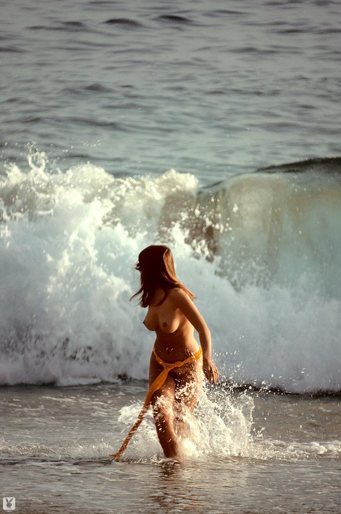 16P Brunette centerfold beauty Patti McGuire poses nude on the beach & on her bed