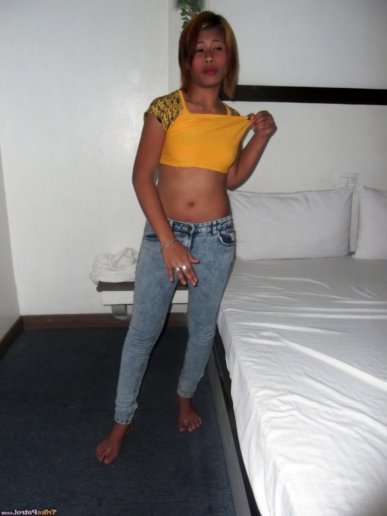 17P Big mouth filipina Wella takes off her clothes to show nice tits on the bed