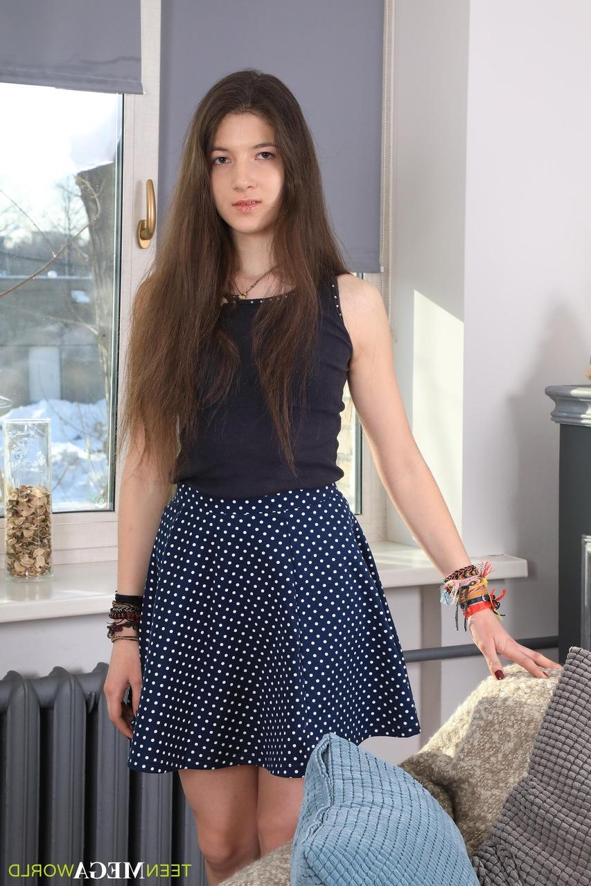 20P Skinny teen Camille drops her skirt and undies and plays with a sex toy