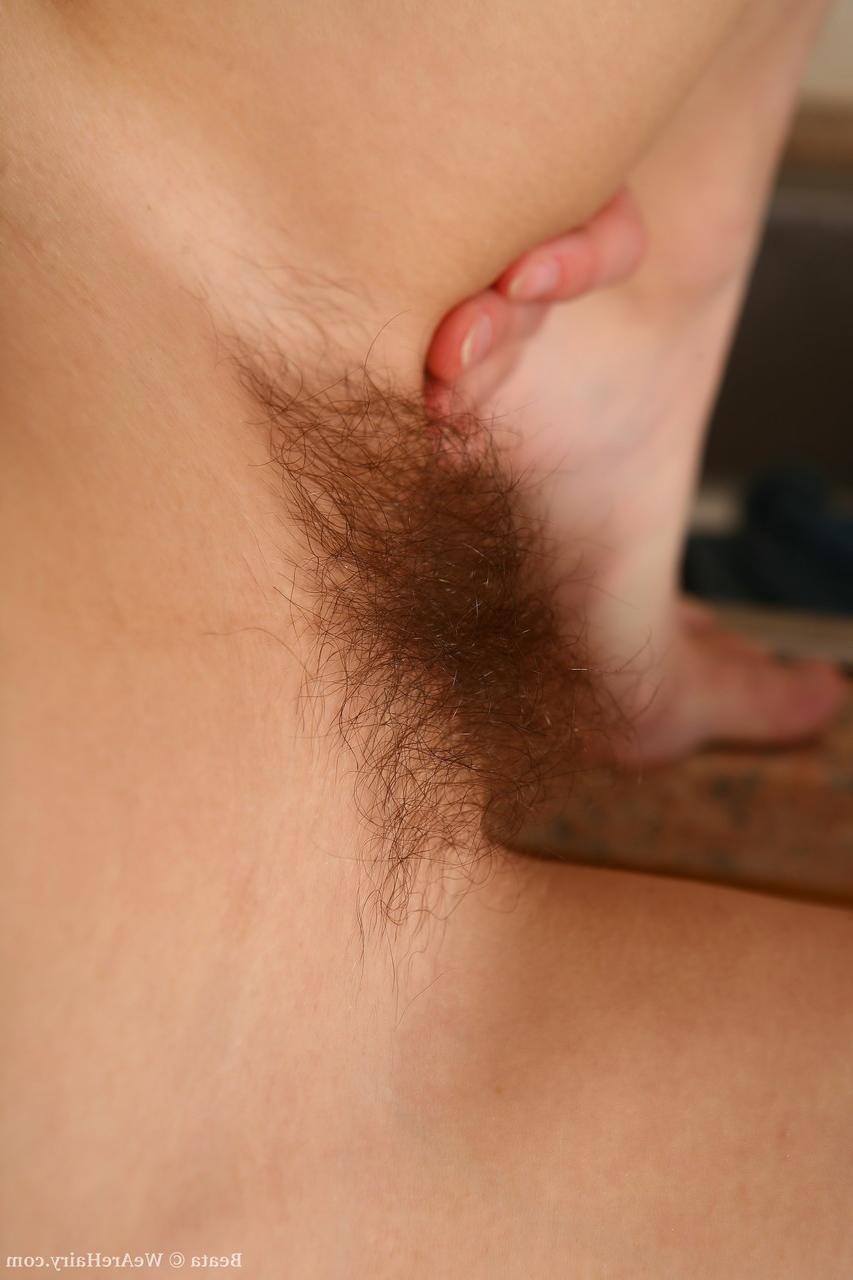 18P Tall hottie Beata exposes her slim shapely body & hairy slit in the kitchen