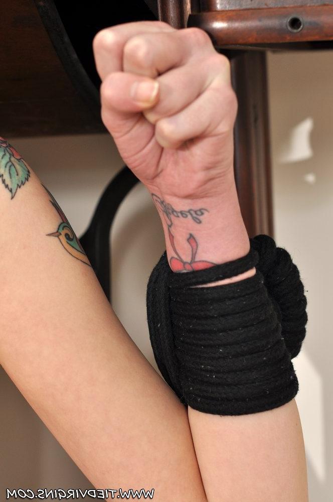 12P Dark haired girl sports a ball gag while tied to a vintage sewing table