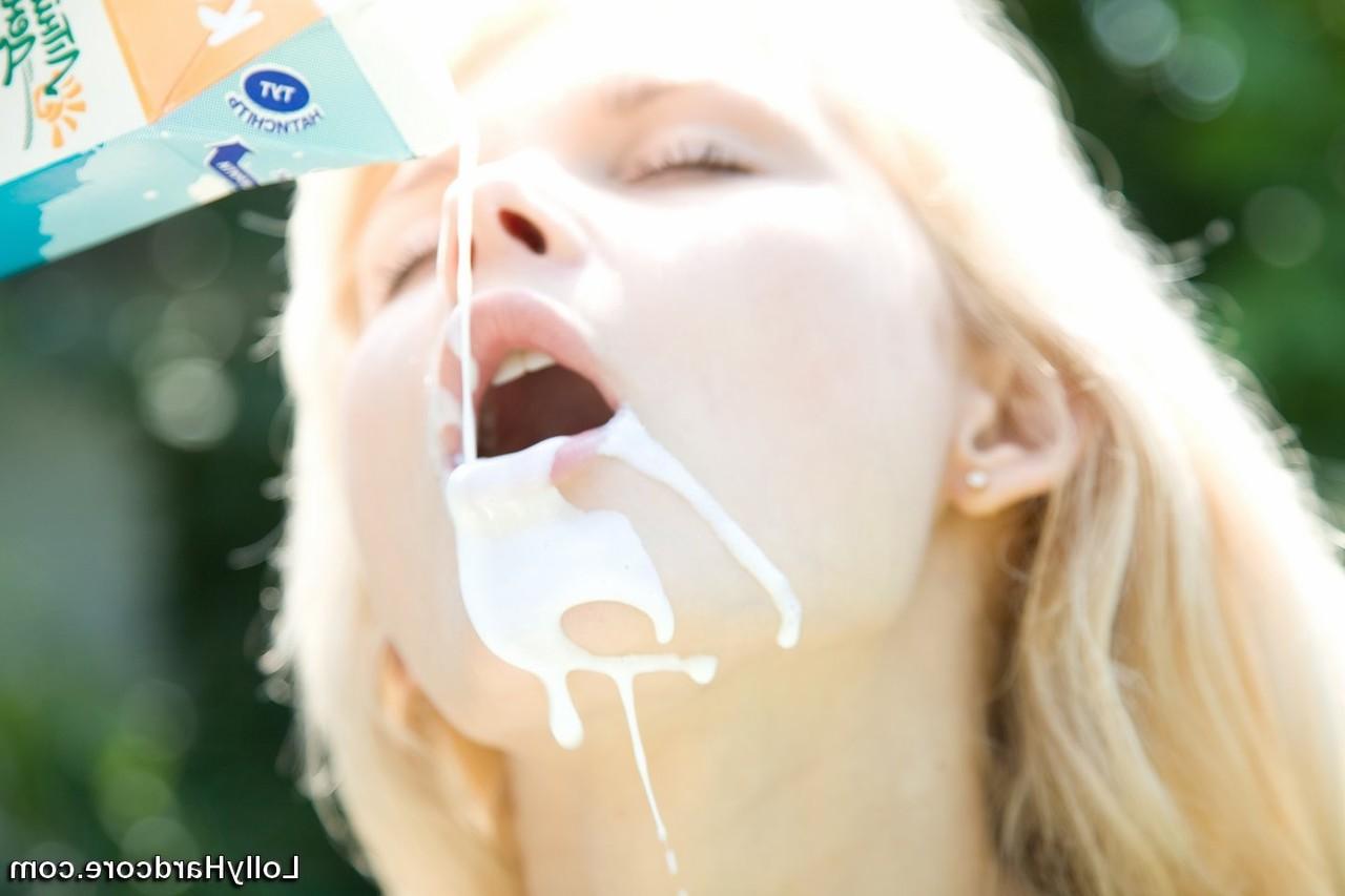 15P Naked blonde Lolly douses herself in milk while in a backyard