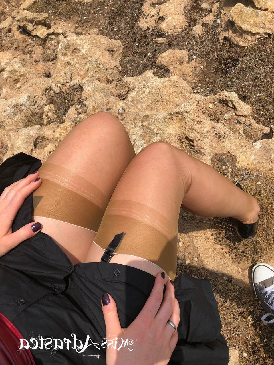 15P Seductive MILF Miss Adrastea flaunts her sexy legs in her stockings outside