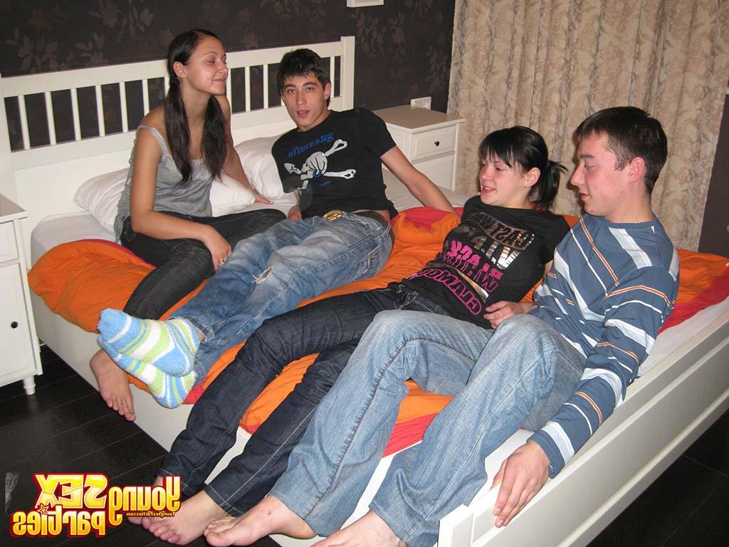 16P Young brunettes and their boyfriends have foursome sex on top of a bed