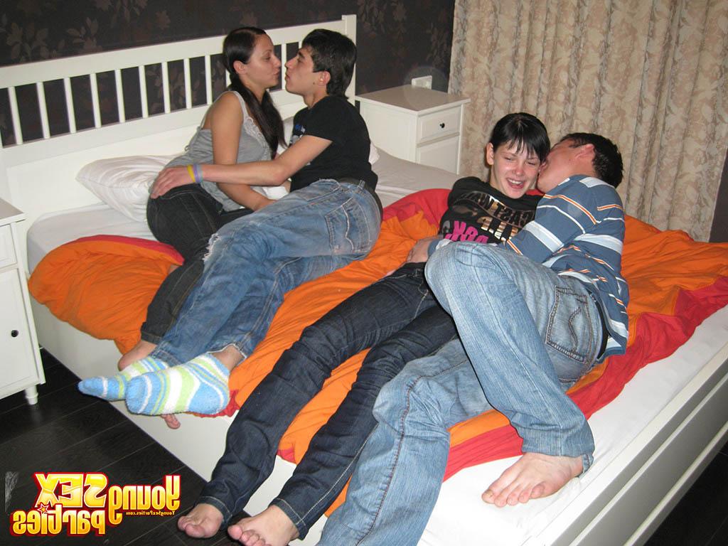 16P Young brunettes and their boyfriends have foursome sex on top of a bed