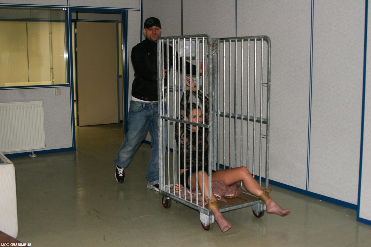 17P Gagged Vixen gets tied up with rope & ball gagged in a luggage transport rack