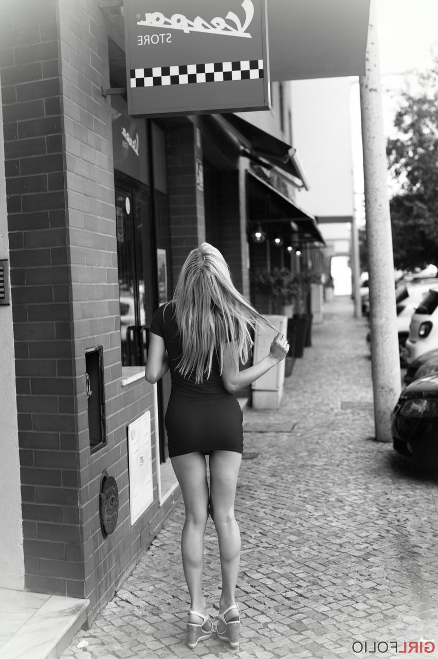 12P Thin blond chick Chloe Toy enjoys a smoke as she goes about her daily business