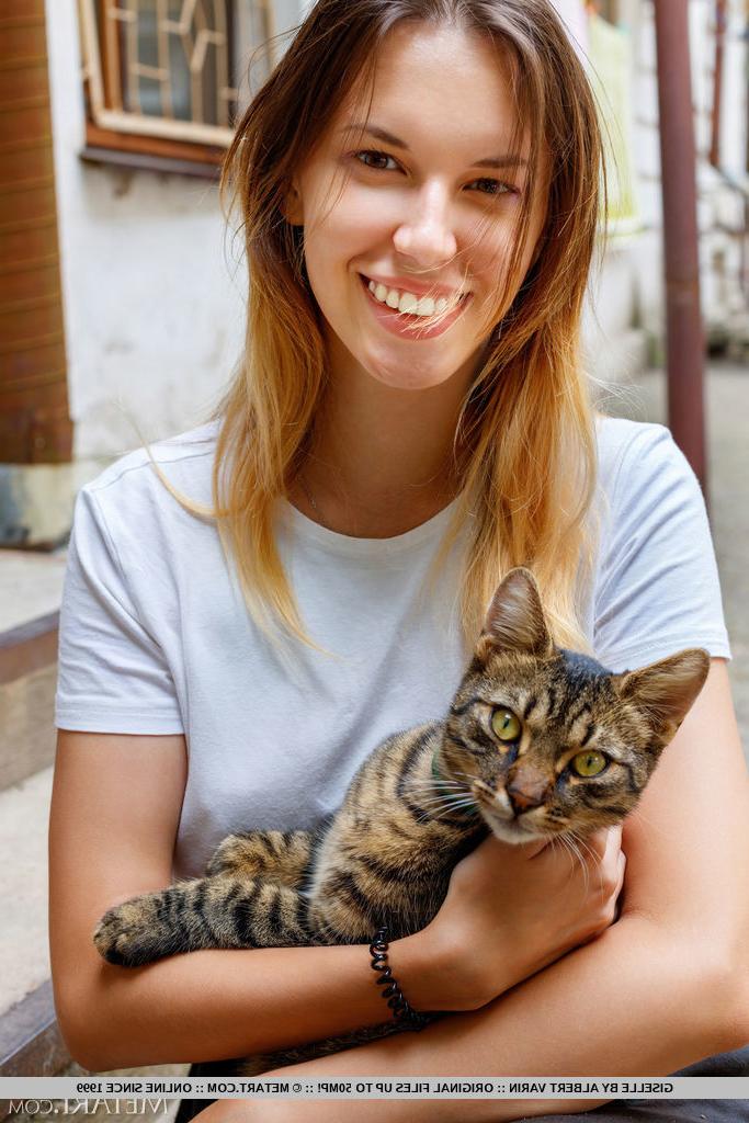 18P Teen solo girl Giselle holds a cat before getting totally naked