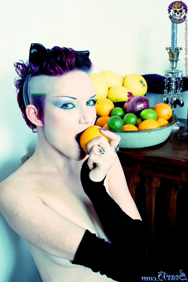 15P Alt girl Scar 13 bites into an in orange and a lemon while totally naked