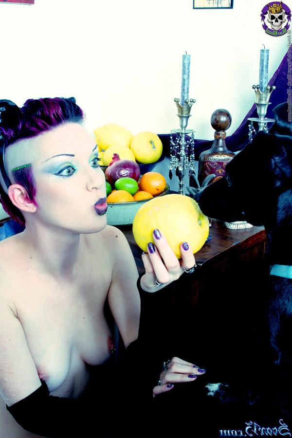 15P Alt girl Scar 13 bites into an in orange and a lemon while totally naked