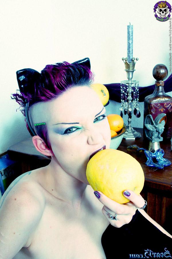 15P Alt girl Scar 13 bites into an in orange and a lemon while totally naked