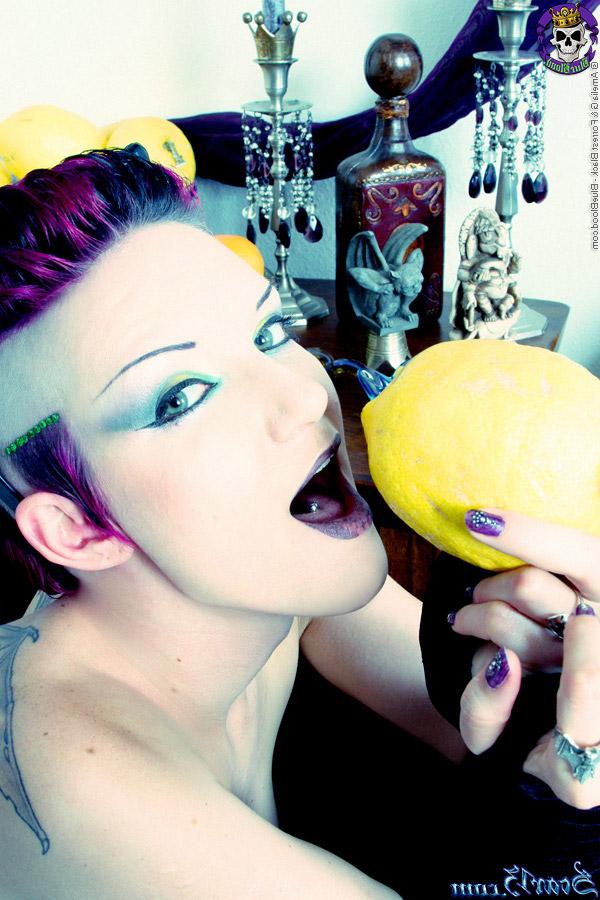 15P Alt girl Scar 13 bites into an in orange and a lemon while totally naked