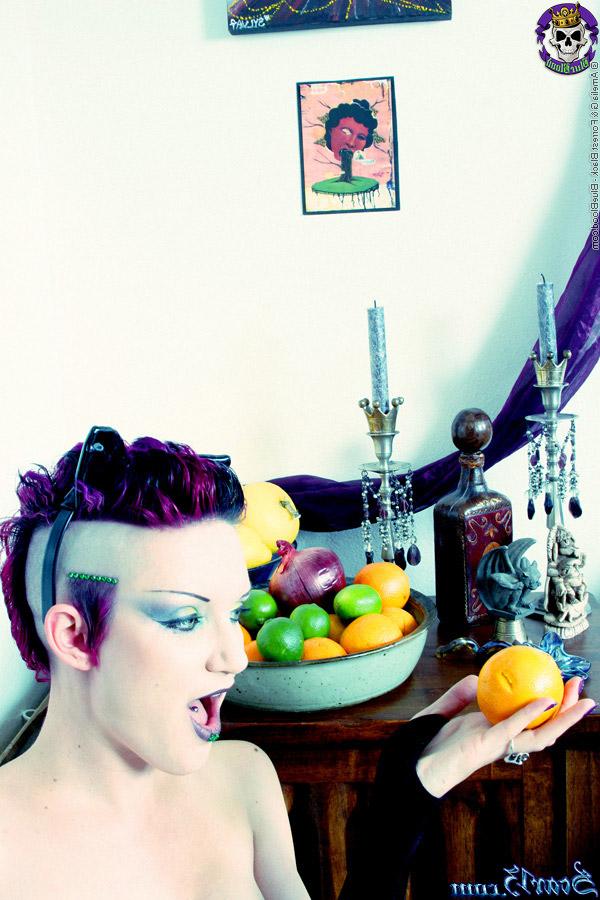 15P Alt girl Scar 13 bites into an in orange and a lemon while totally naked