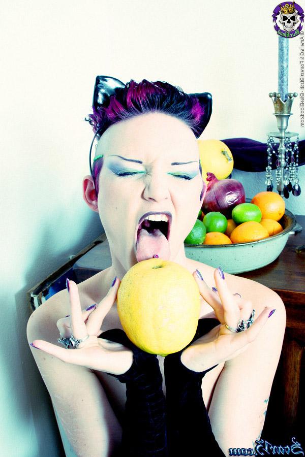 15P Alt girl Scar 13 bites into an in orange and a lemon while totally naked