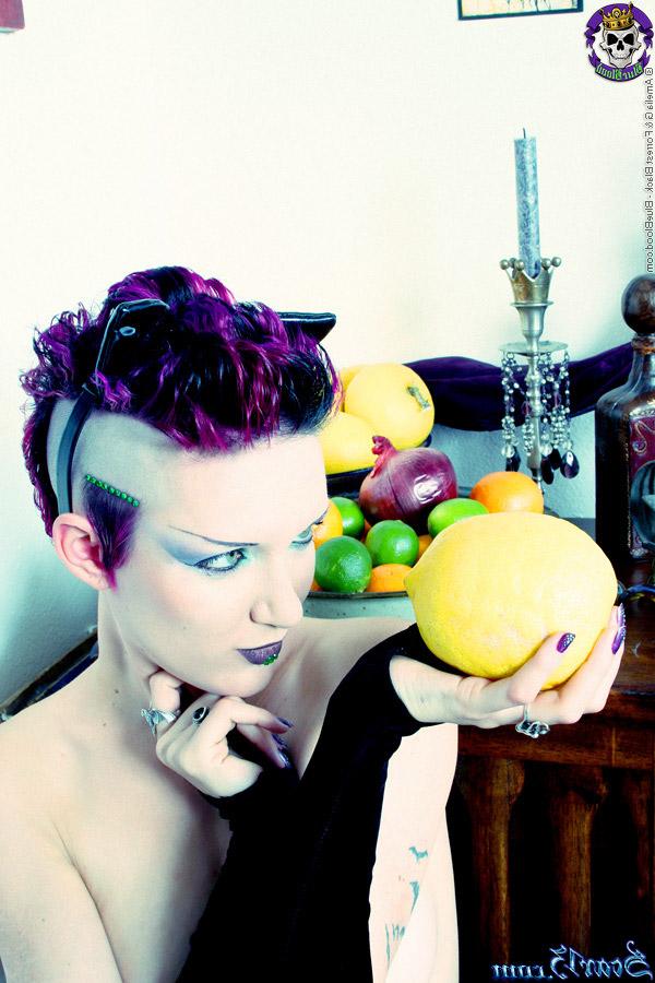 15P Alt girl Scar 13 bites into an in orange and a lemon while totally naked