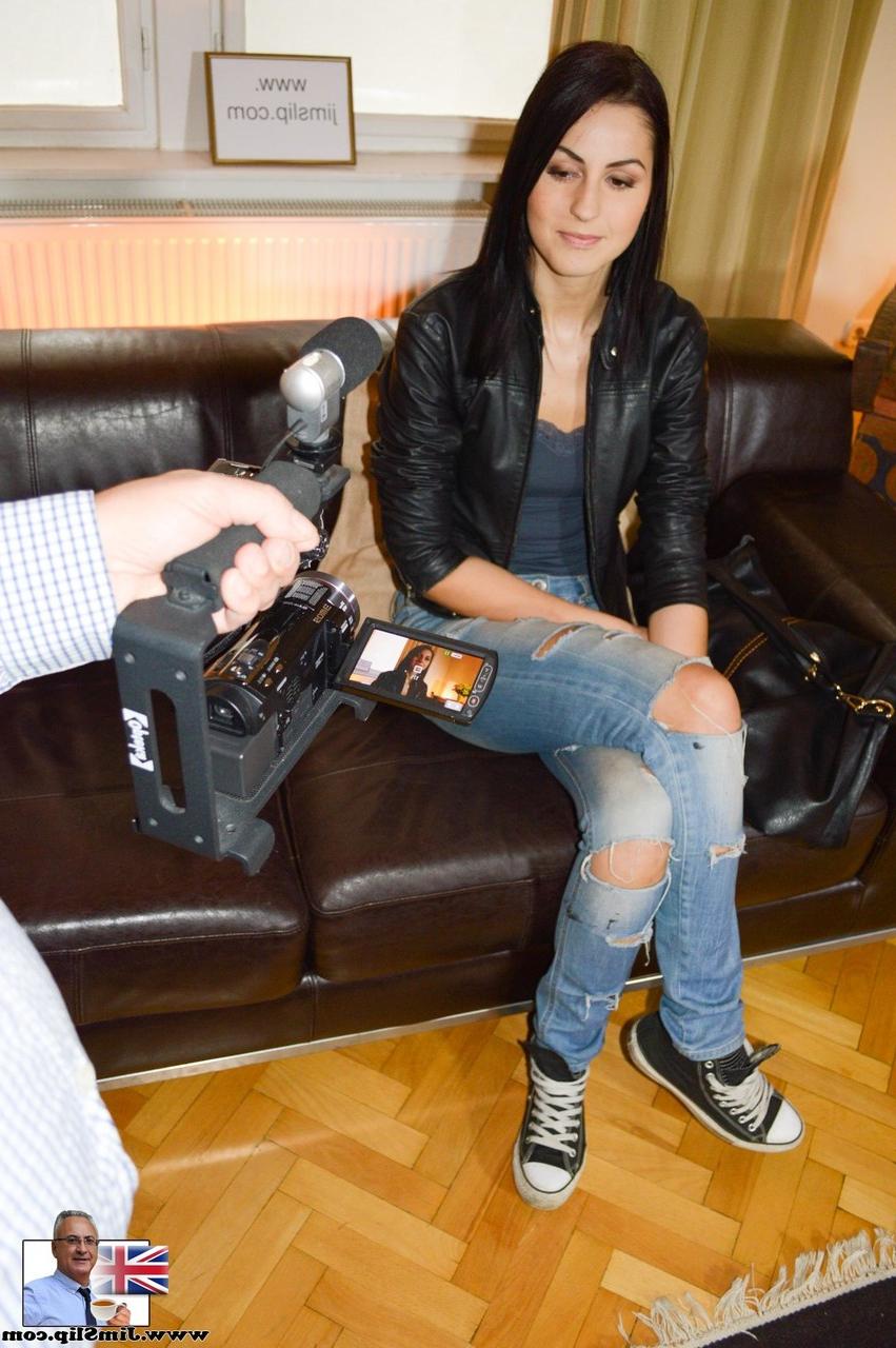 20P Tall brunette Meg Magic strips and poses in front of photographer Jim Slip