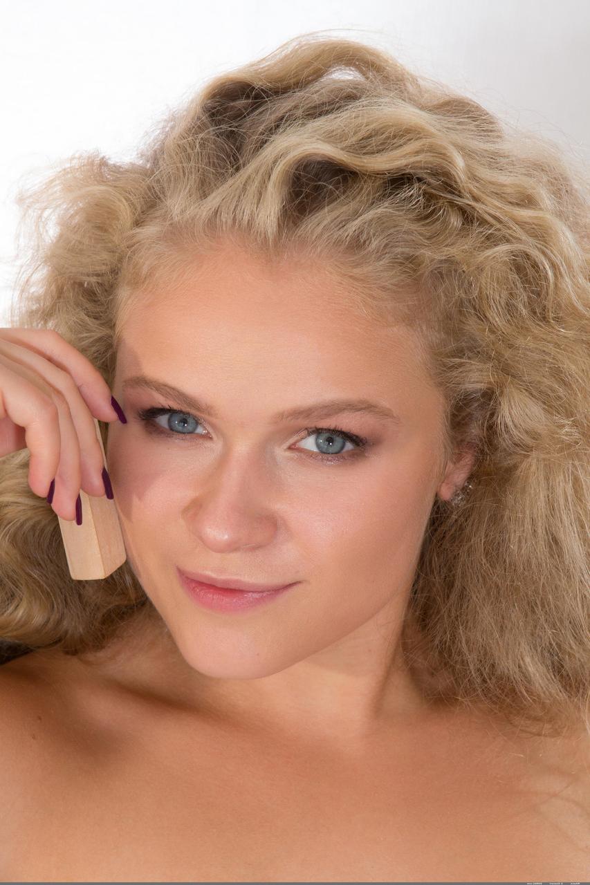 20P Curly haired blonde Mikana flaunts her cute ass and tits while playing Yenga