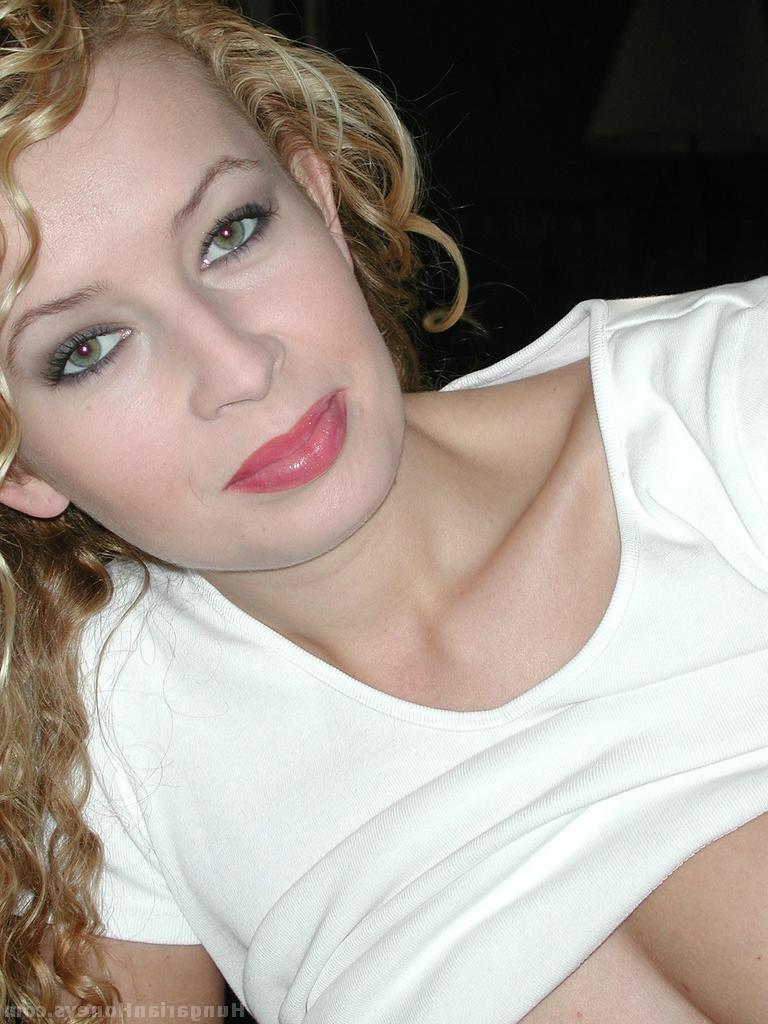 20P Curly-haired teen Nicole Wild masturbates with a toy and spreads her pussy