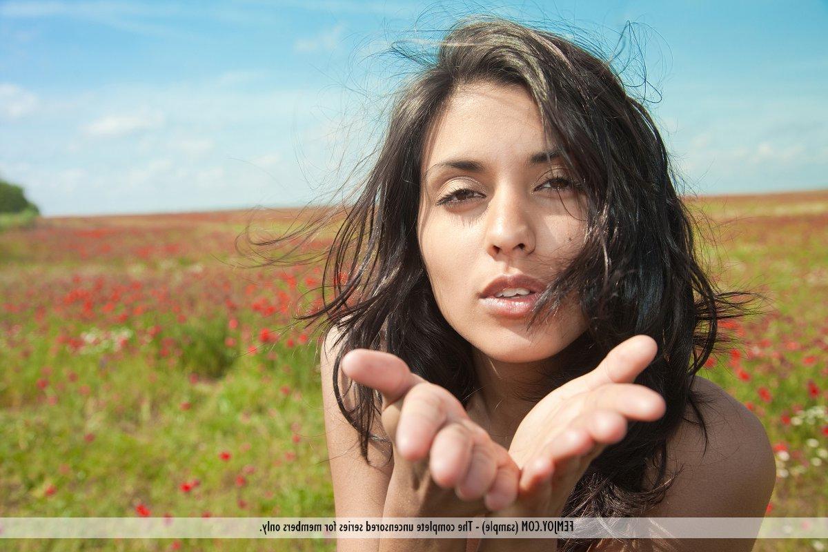 16P Young brunette Adrienne wanders bare naked in a field of poppies