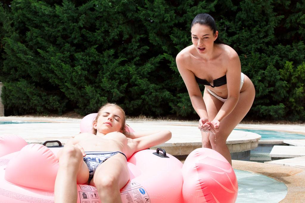 16P Young lesbians Emelie Crystal and Lee Anne lick each others pussy near a pool
