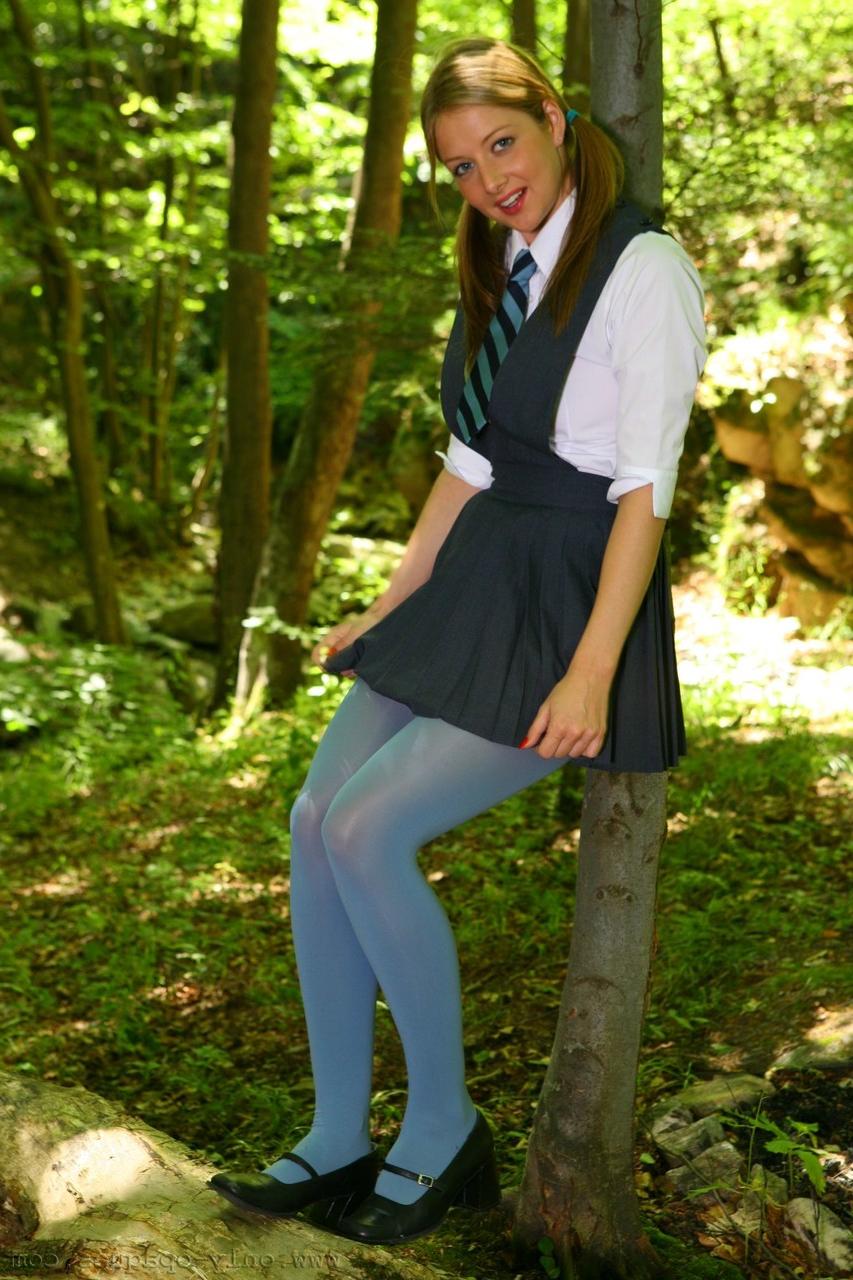 20P Horny schoolgirl Maddie M stripping to her blue pantyhose in the woods