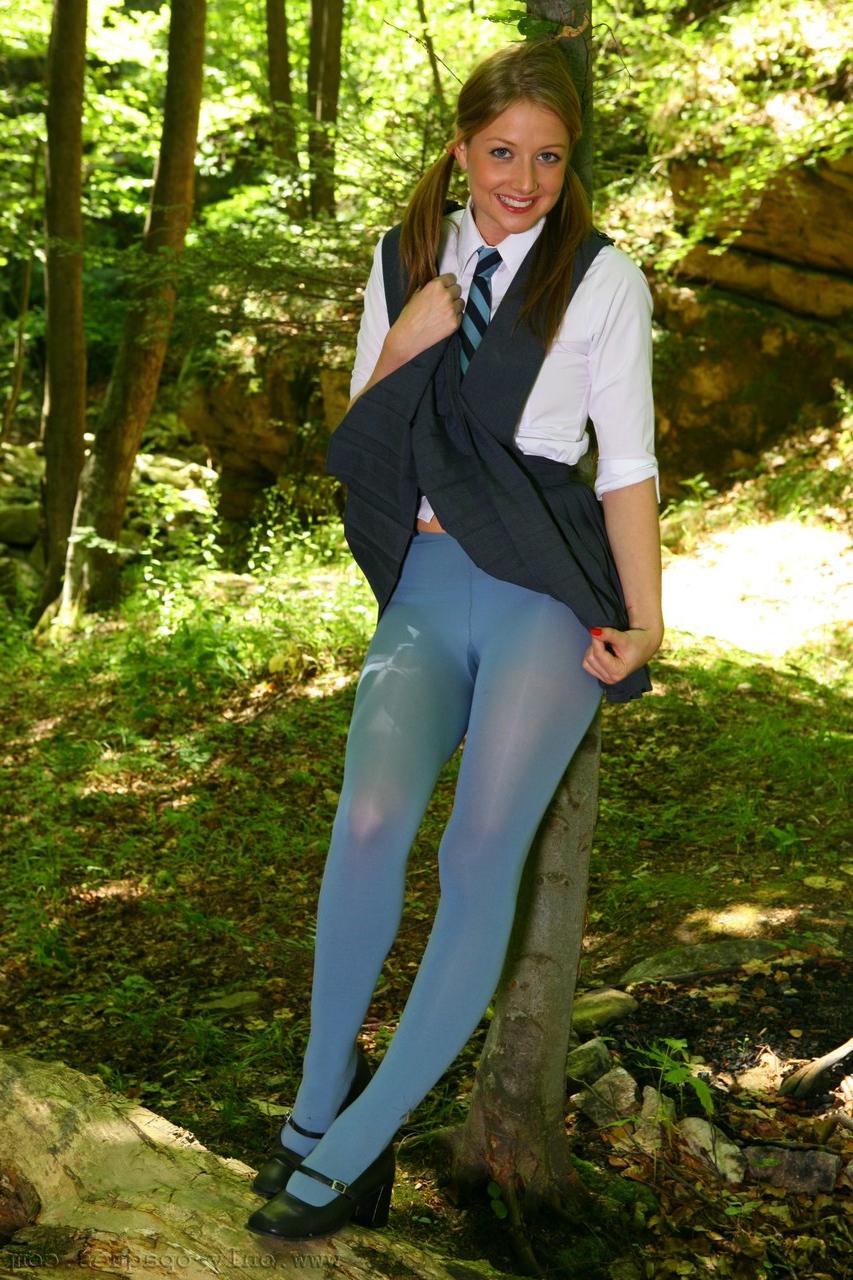 20P Horny schoolgirl Maddie M stripping to her blue pantyhose in the woods