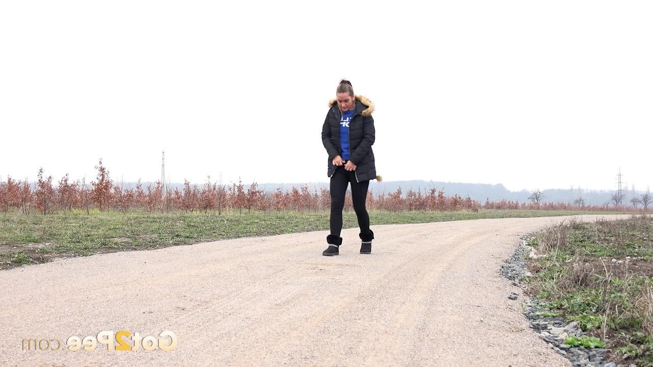 15P Fully clothed girl Naomi Bennet pulls down her pants to piss on a dirt road