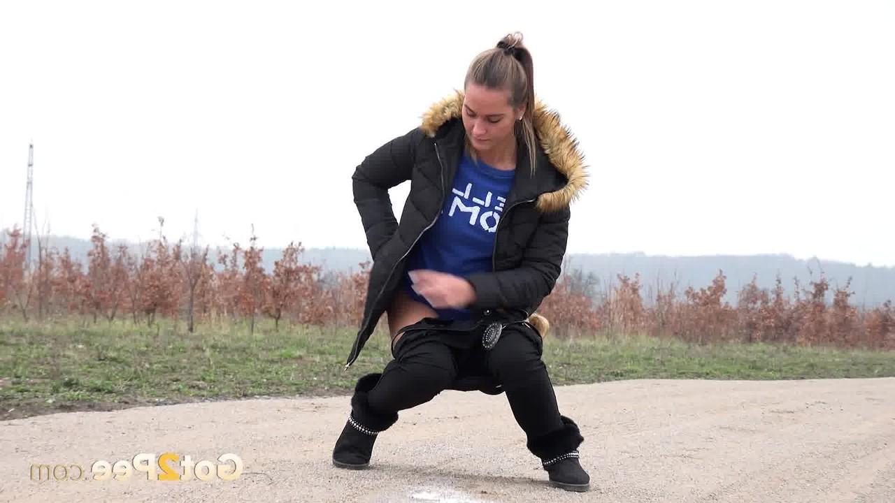 15P Fully clothed girl Naomi Bennet pulls down her pants to piss on a dirt road