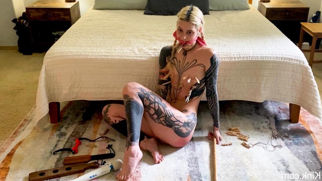 18P Slender babe with tattoos Cam Damage tries out bondage tools on the floor