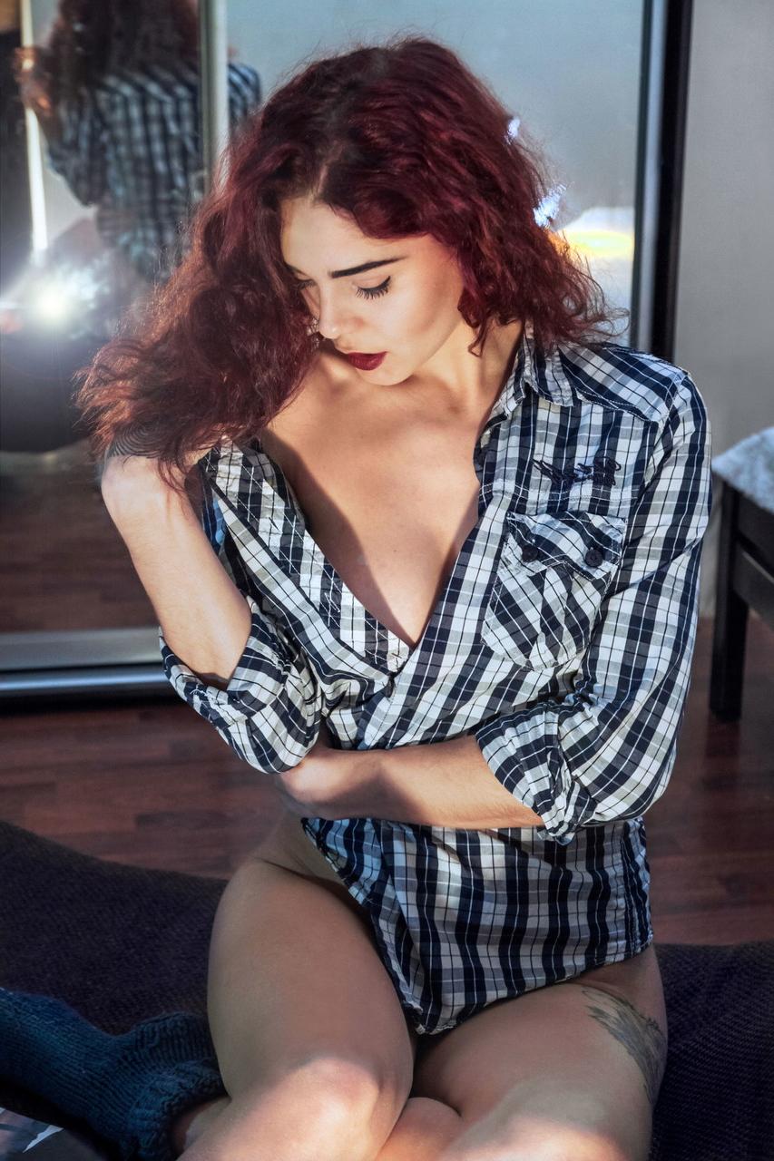 17P Redhead tattooed beauty Calista shows a closeup of her shaved pussy