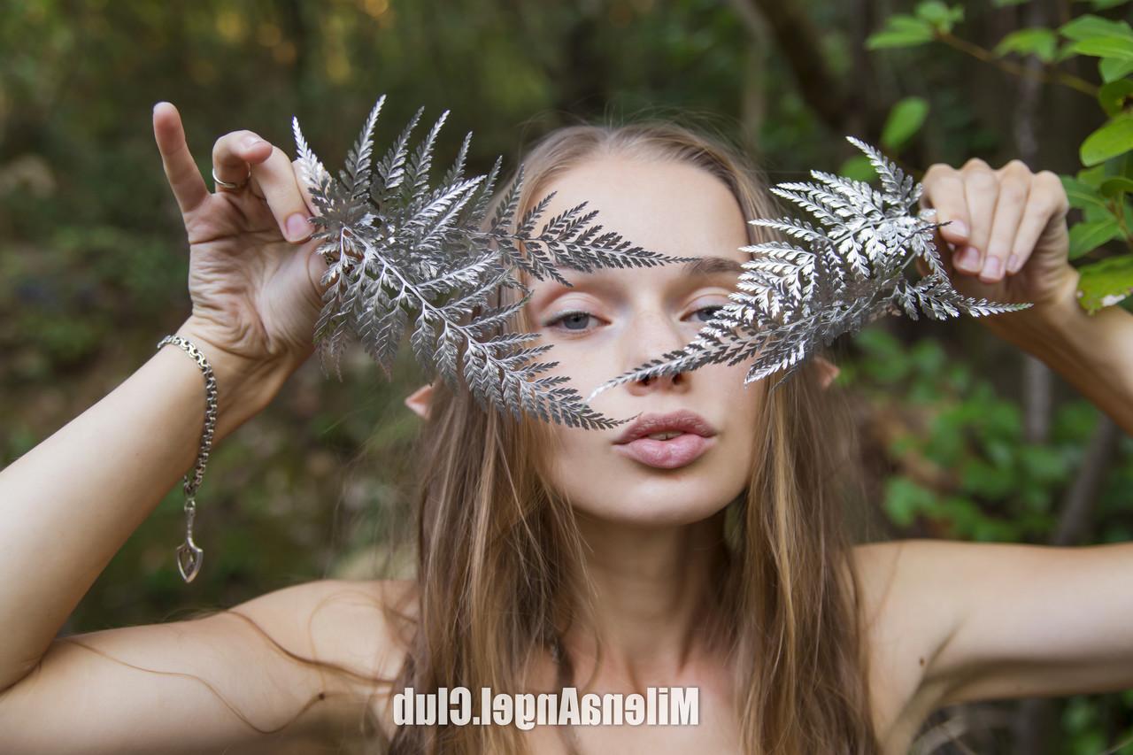 15P Gorgeous skinny model Milena Angel flaunts her tiny tits and twat in the woods