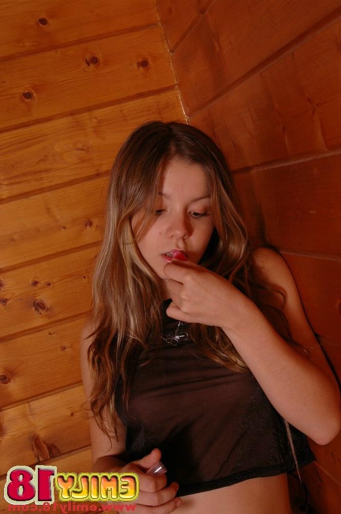 15P Barely legal cutie sticks out her tongue while going topless in a thong