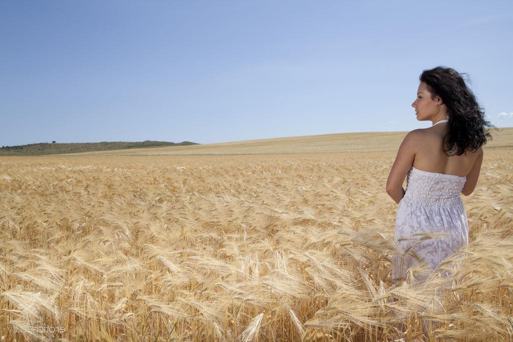 16P Young brunette Maliko works her bare ass after getting naked in wheat field