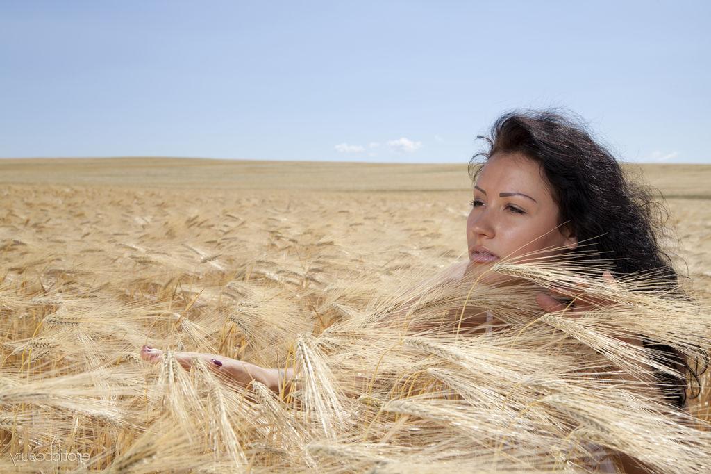 16P Young brunette Maliko works her bare ass after getting naked in wheat field