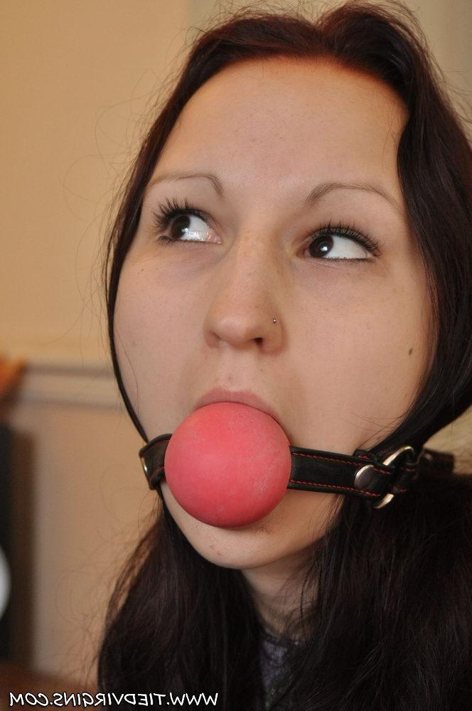 12P Caucasian girl is tied to a chair with a big ball gag in her mouth