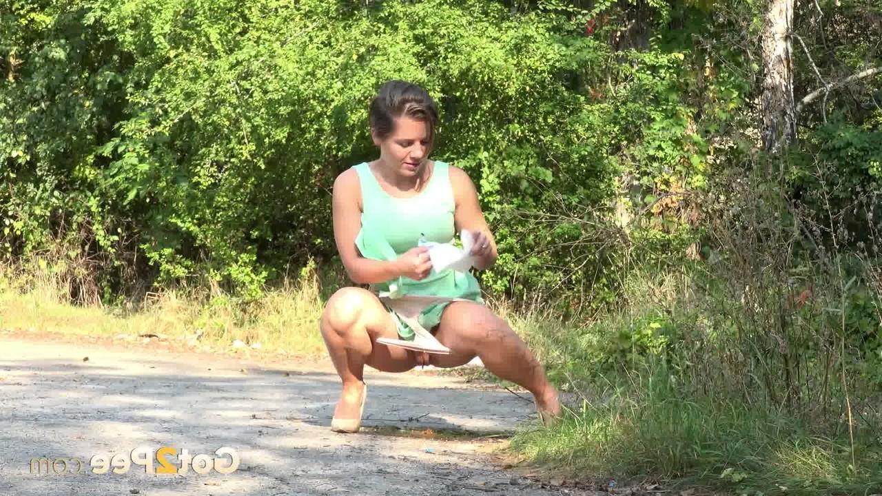 15P White chick pulls down her panties and squats for a piss on a country path