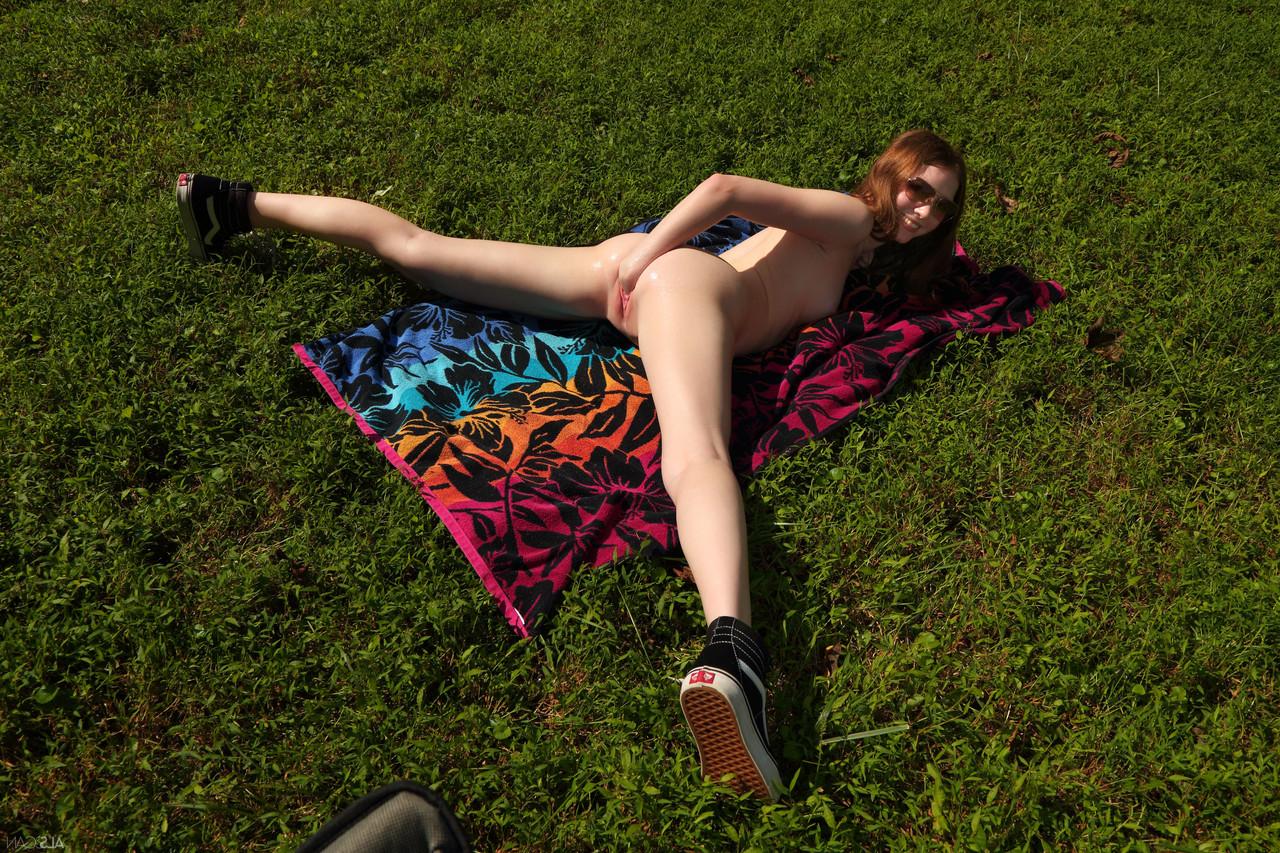 20P Cute amateur babe Myra Glasford strips and masturbates while on a camping trip