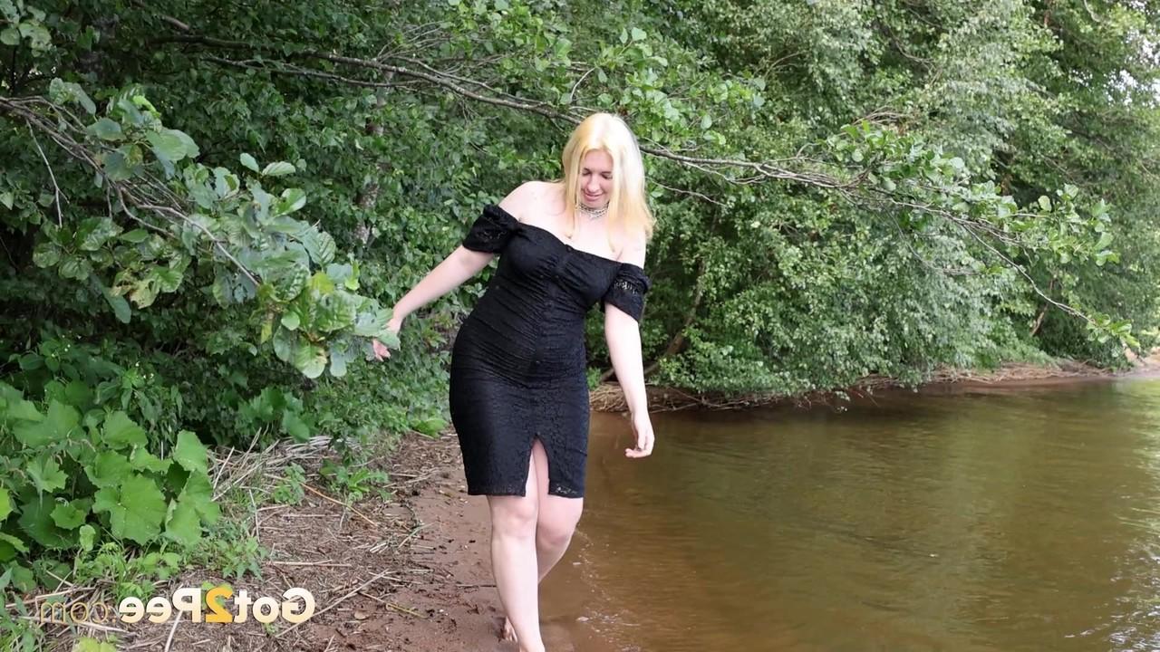 15P Blonde girl Magnolia stands in the water while taking a piss