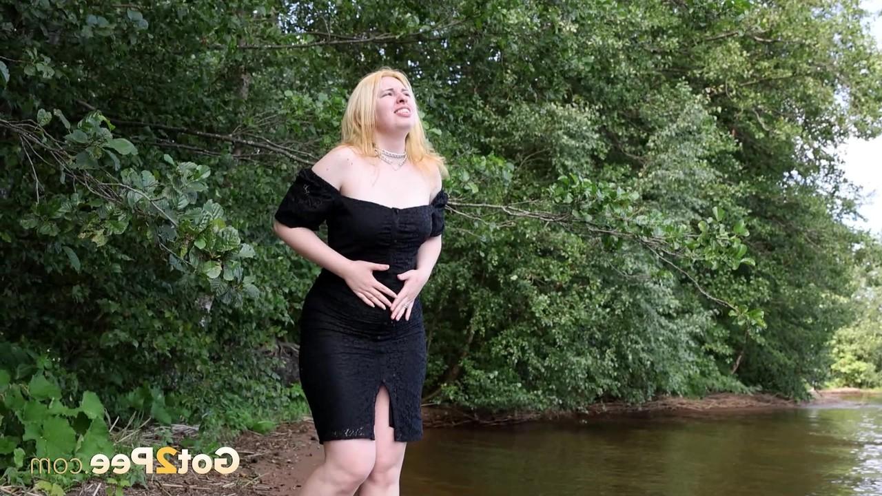 15P Blonde girl Magnolia stands in the water while taking a piss