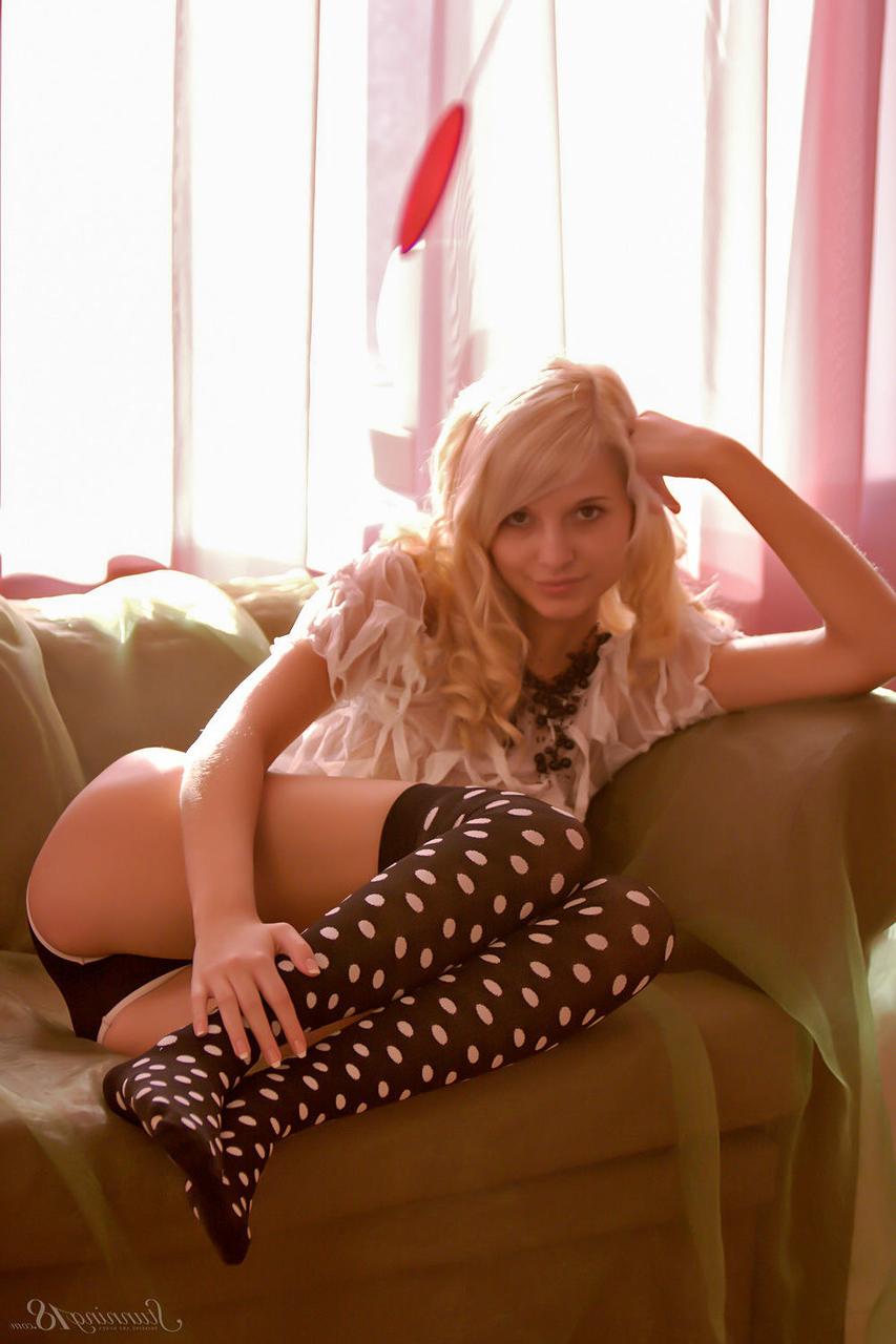 16P 18-year-old blonde Eyra U gets naked while wearing OTK polka-dot socks