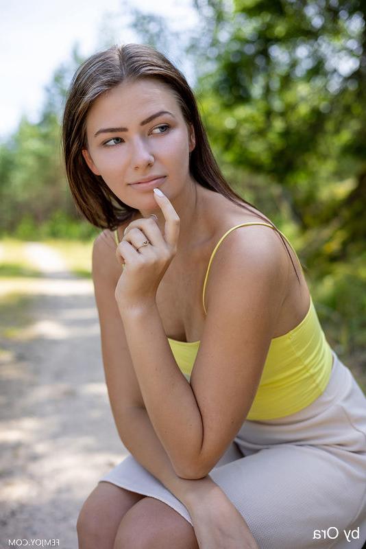16P Brunette teen gets bare naked on a gravel driveway in the countryside