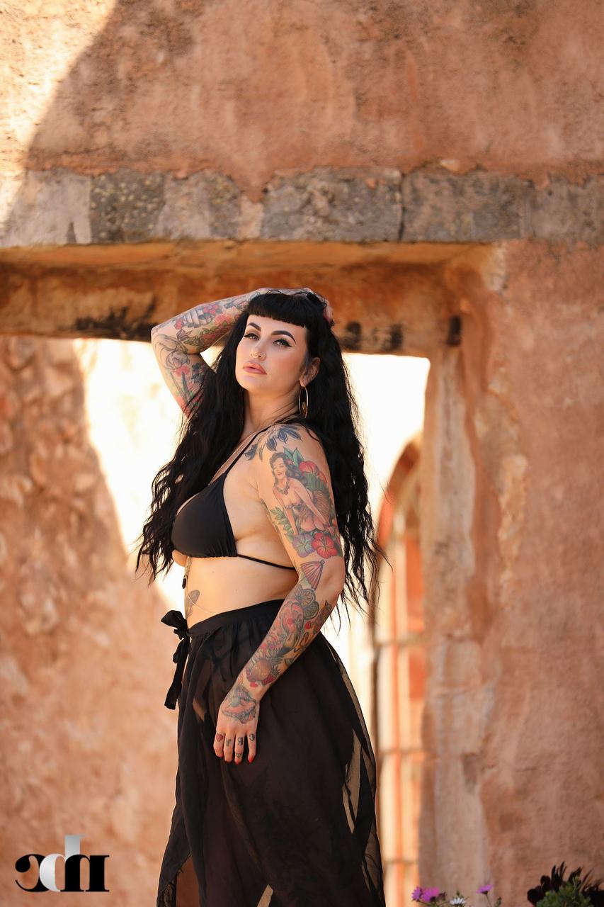 20P Raven haired babe Cherrie Pie reveals her tattoos and huge boobs outdoors