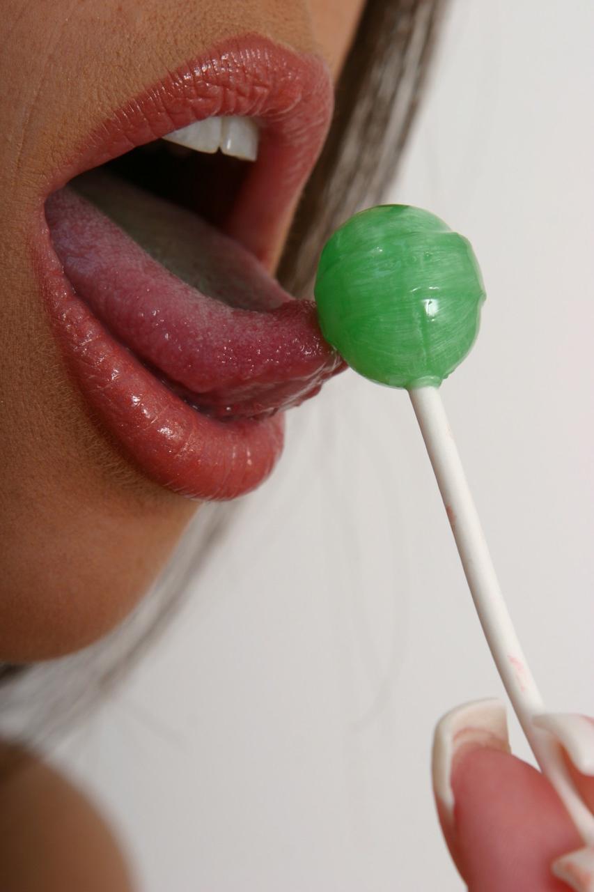 20P Teen Cassia rolls a lollypop over her shaved pussy then sucks it in the toilet