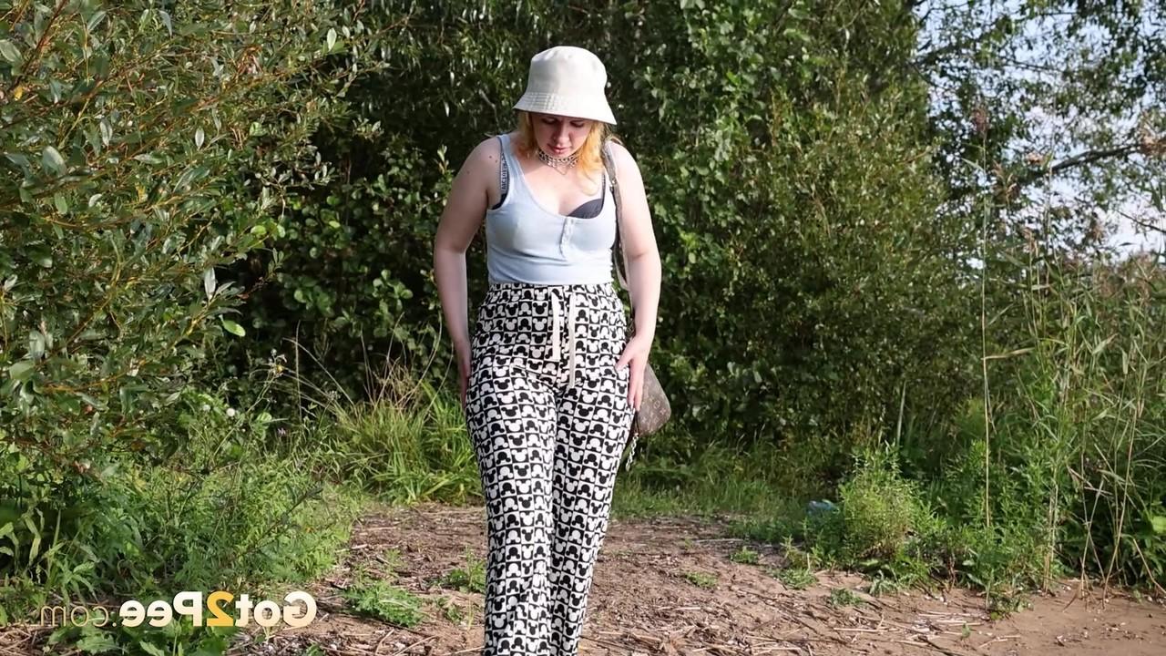 15P Caucasian girl Magnolia takes a badly needed piss near some bushes