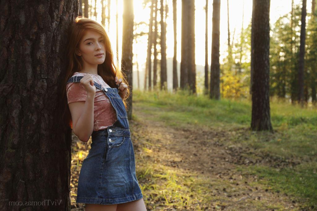 16P Natural redhead Jia Lissa sucks on a finger after disrobing in the woods