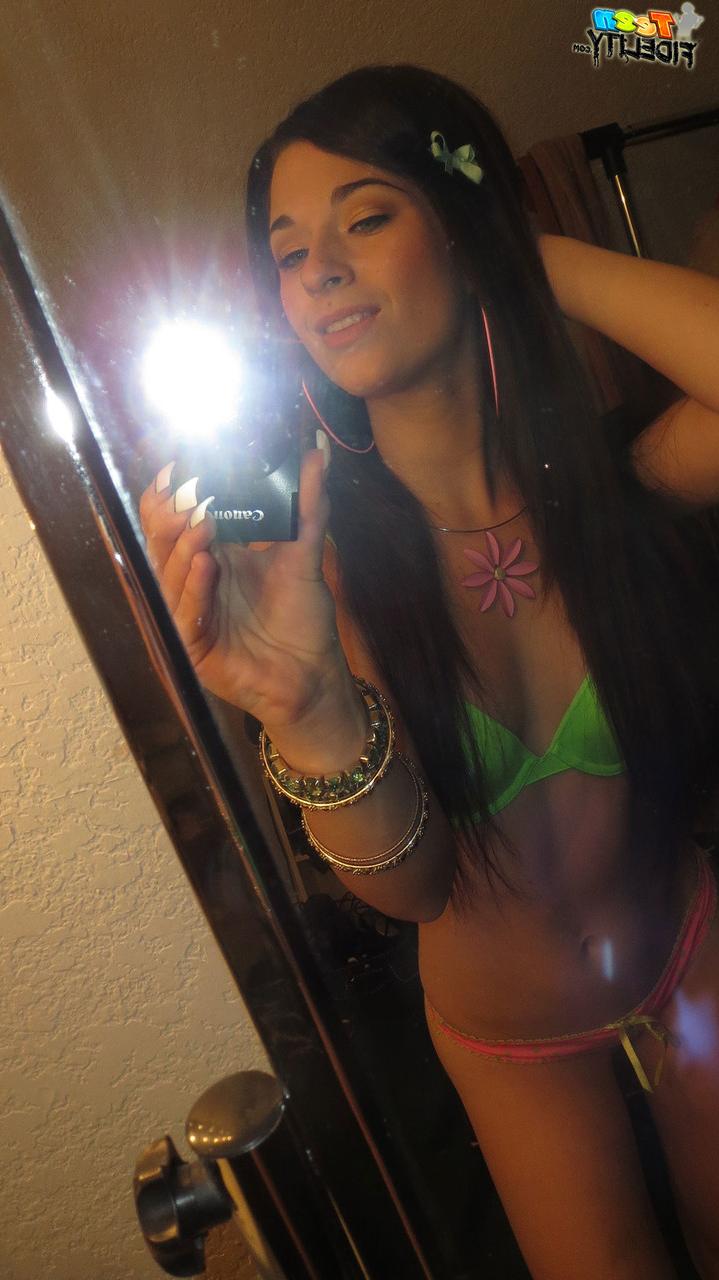 18P Long-haired brunette with slender body Lacy Channing takes sexy photos at home