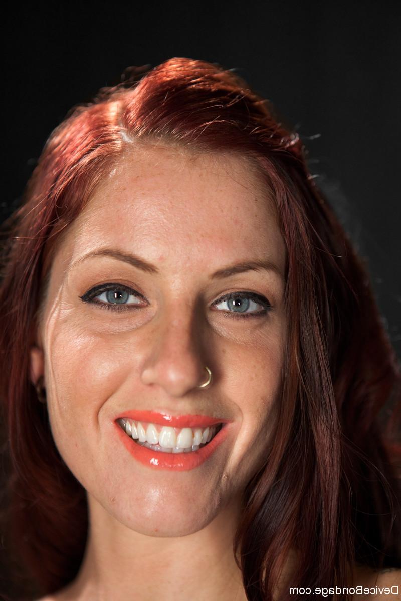 17P Redheaded sex slave is held in chains while being whipped and masturbated