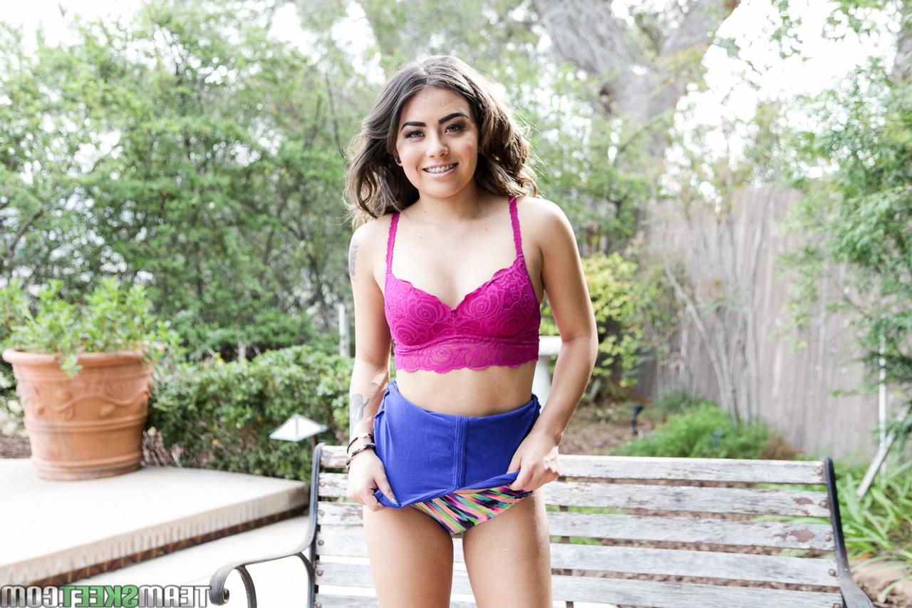 17P Cute brunette chick Amina Allure gets naked outdoors near the pool